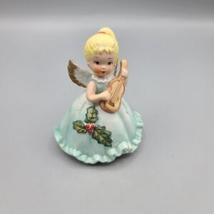Vintage Christmas Girl Playing Ukalale Ceramic Poinsettia Figurine